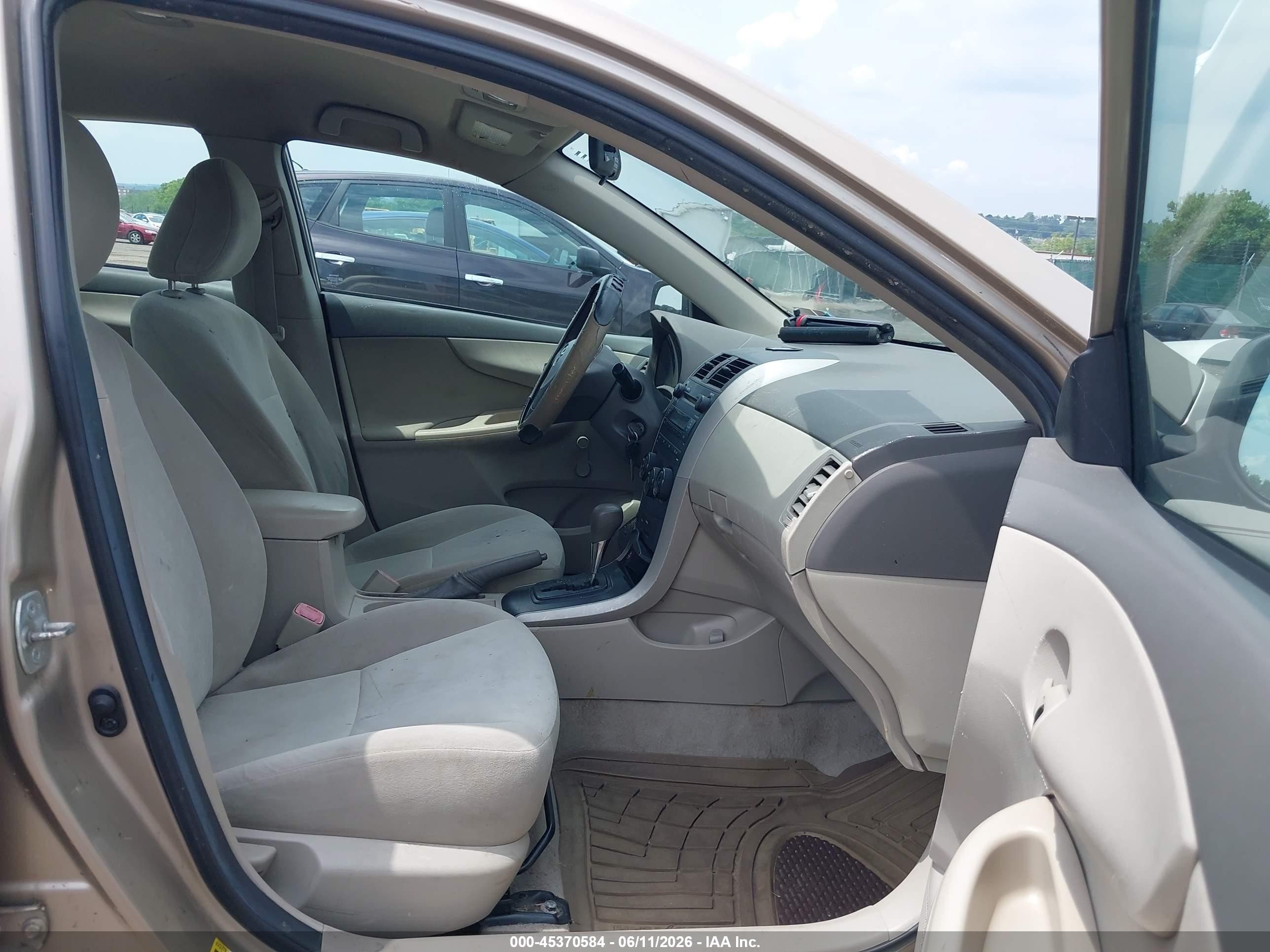 2009 Toyota Corolla   Tan vin: 1NXBU40E79Z078969