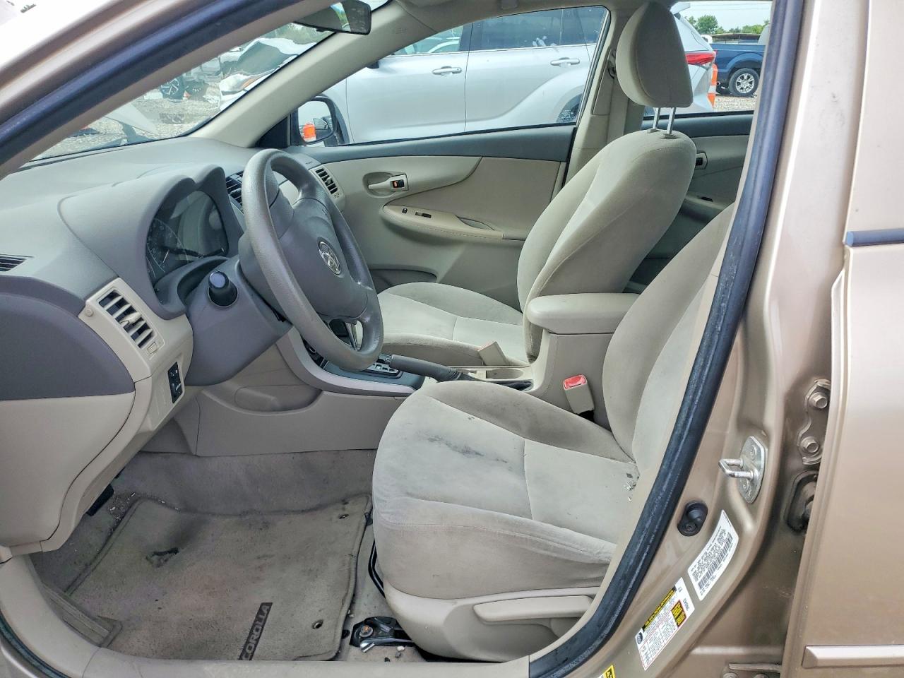 2009 Toyota Corolla Le Tan vin: 1NXBU40E79Z128723