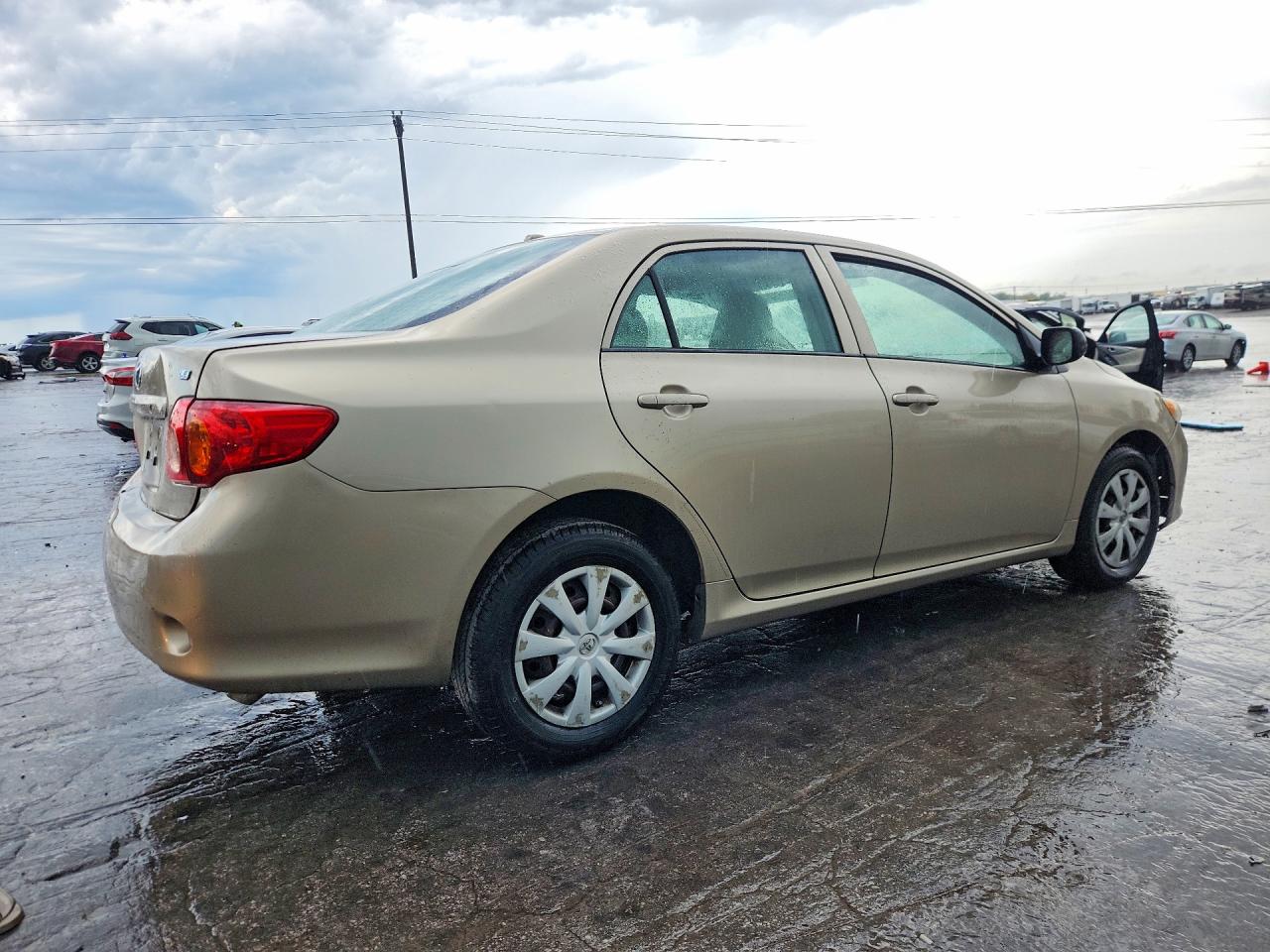 2009 Toyota Corolla Le Tan vin: 1NXBU40E79Z151631