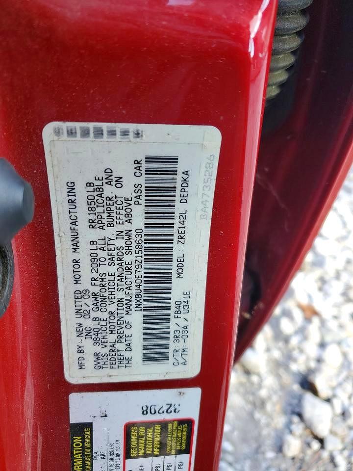 2009 Toyota Corolla Le Red vin: 1NXBU40E79Z158630