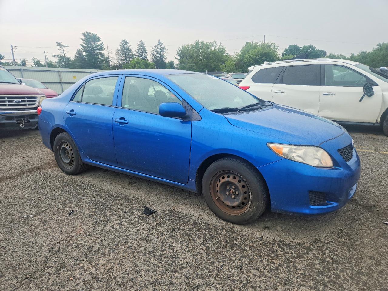 2009 Toyota Corolla Le Blue vin: 1NXBU40EX9Z085477