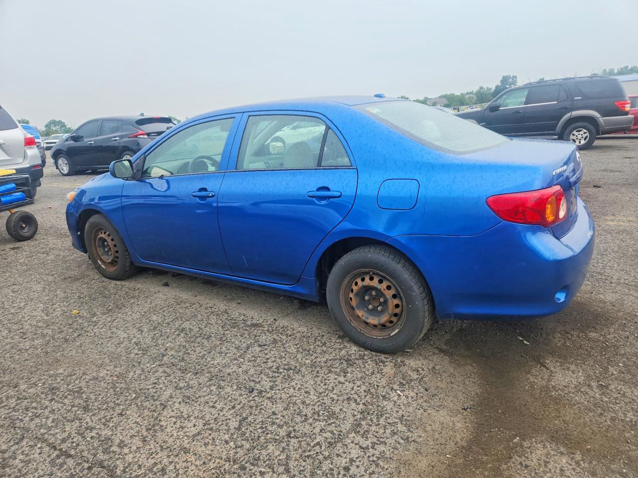 2009 Toyota Corolla Le Blue vin: 1NXBU40EX9Z085477