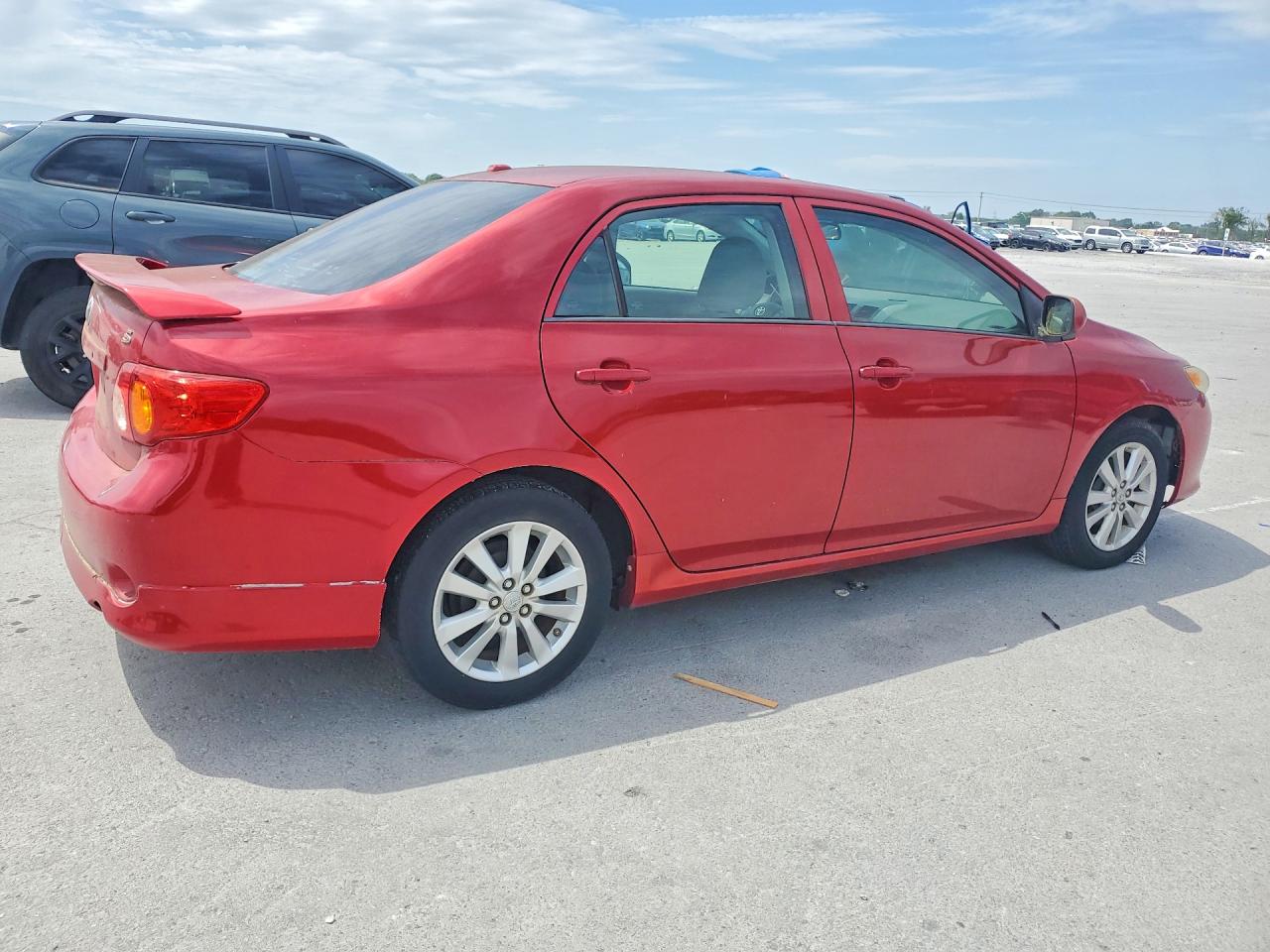 2009 Toyota Corolla Le Red vin: 1NXBU40EX9Z111639