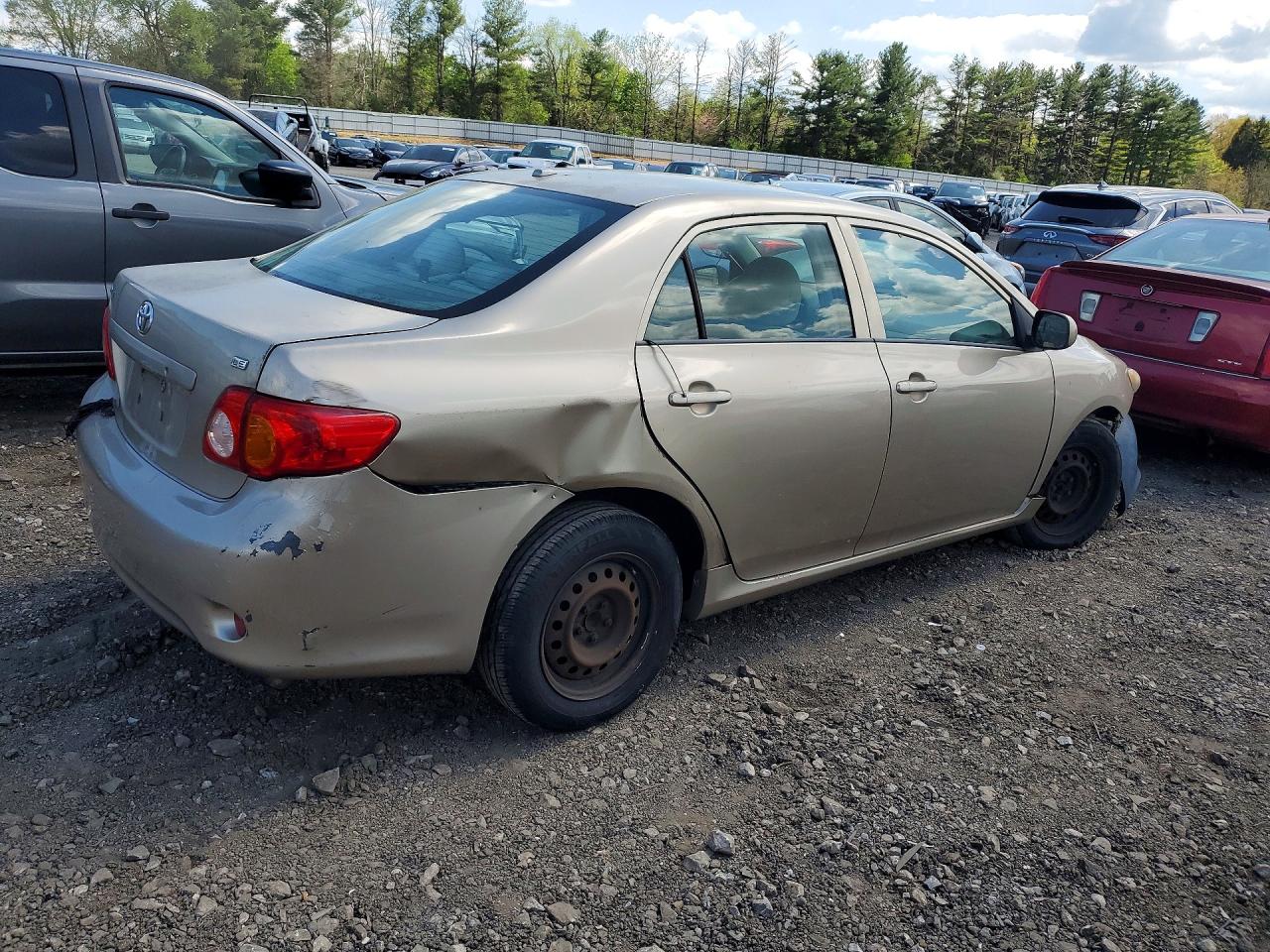 2009 Toyota Corolla Le Beige vin: 1NXBU40EX9Z130823