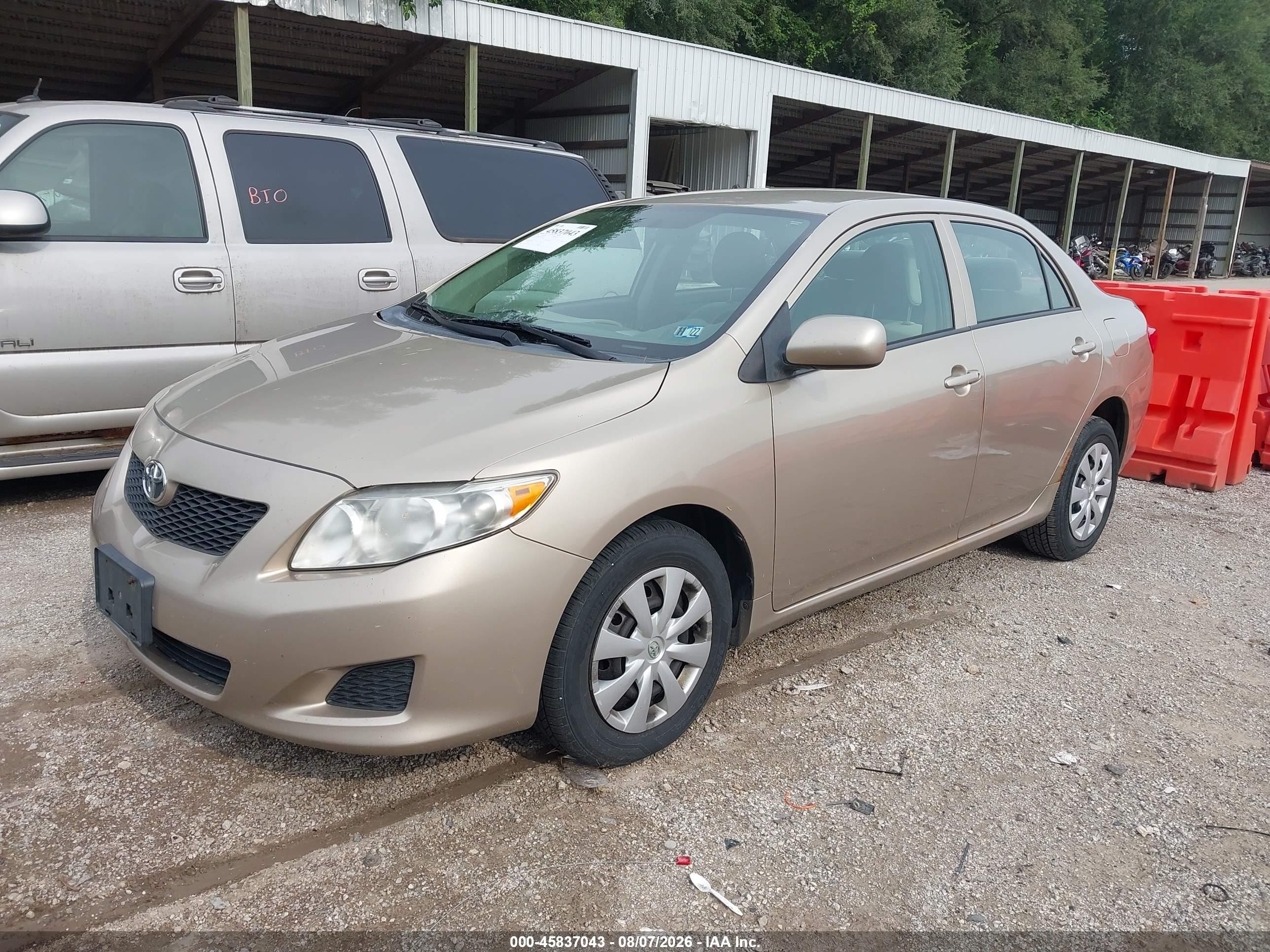2010 Toyota Corolla Le Tan vin: 1NXBU4EE2AZ204992