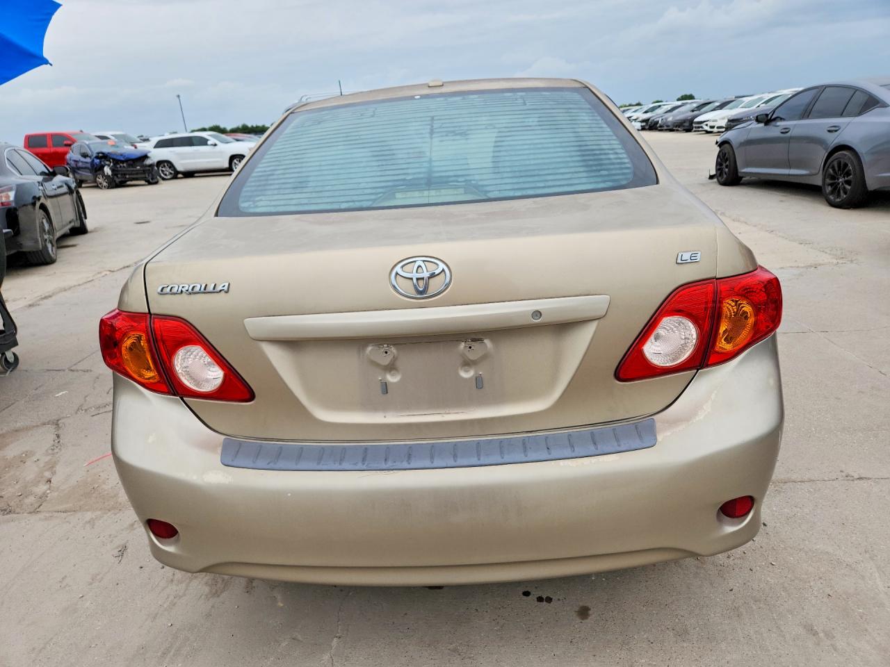 2010 Toyota Corolla Le Gold vin: 1NXBU4EE3AZ237757