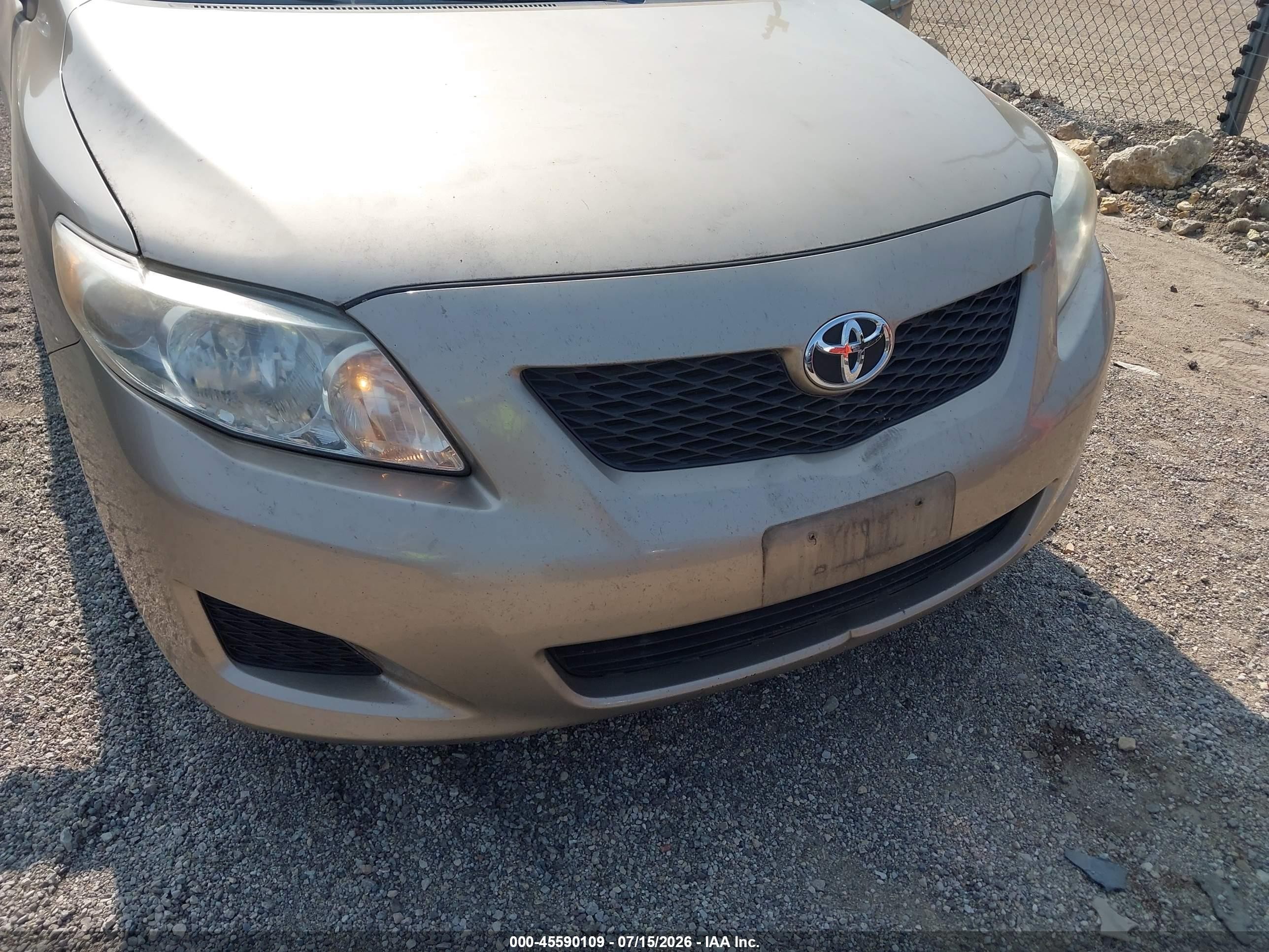 2010 Toyota Corolla Le Champagne vin: 1NXBU4EE4AZ220840