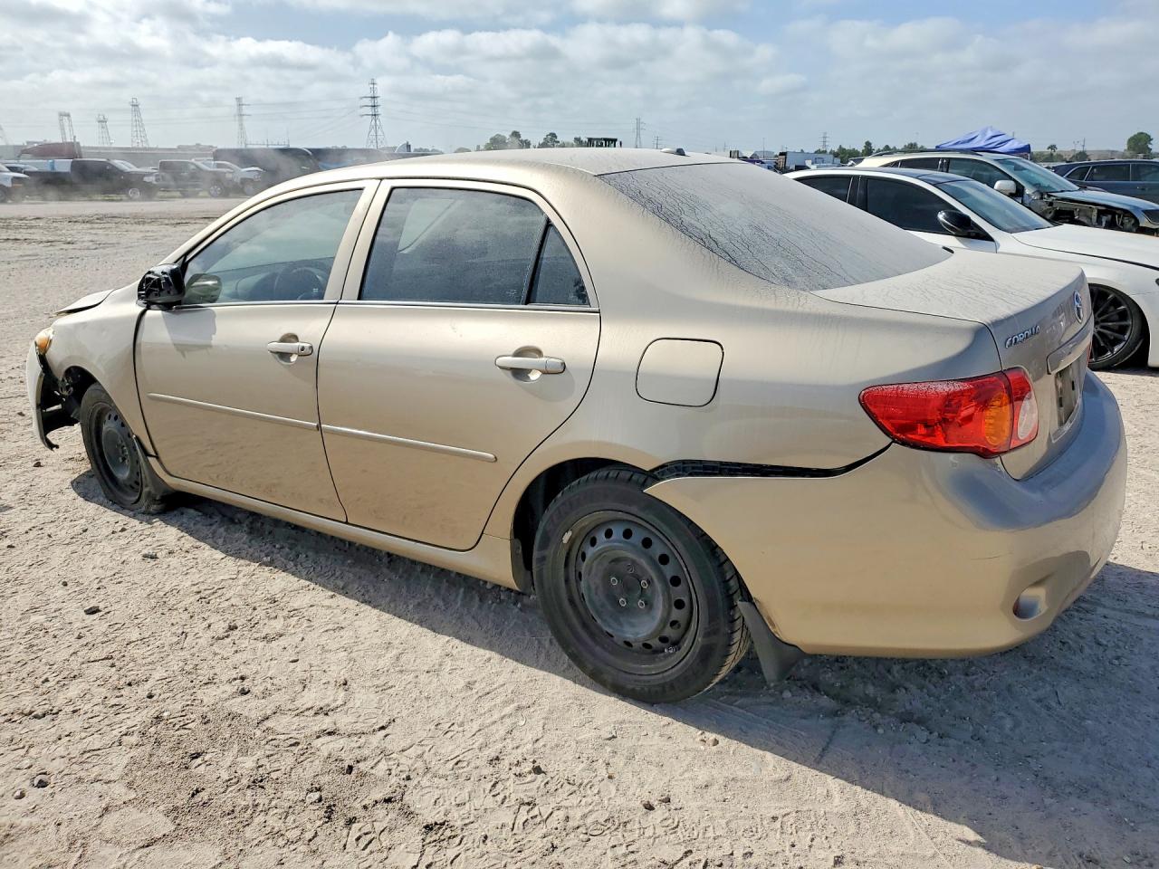 2010 Toyota Corolla Le Gold vin: 1NXBU4EE6AZ284006