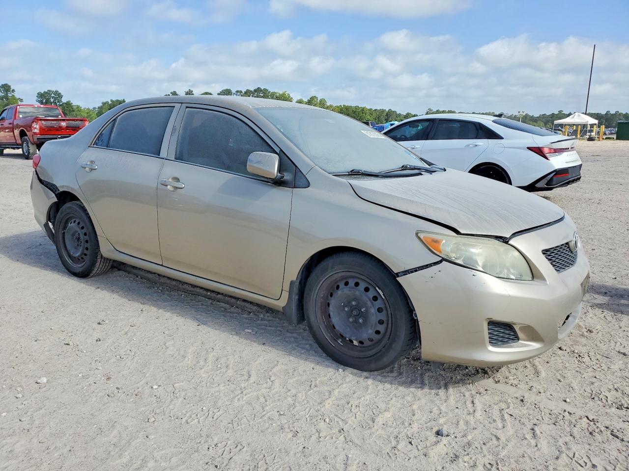 2010 Toyota Corolla Le Gold vin: 1NXBU4EE6AZ284006