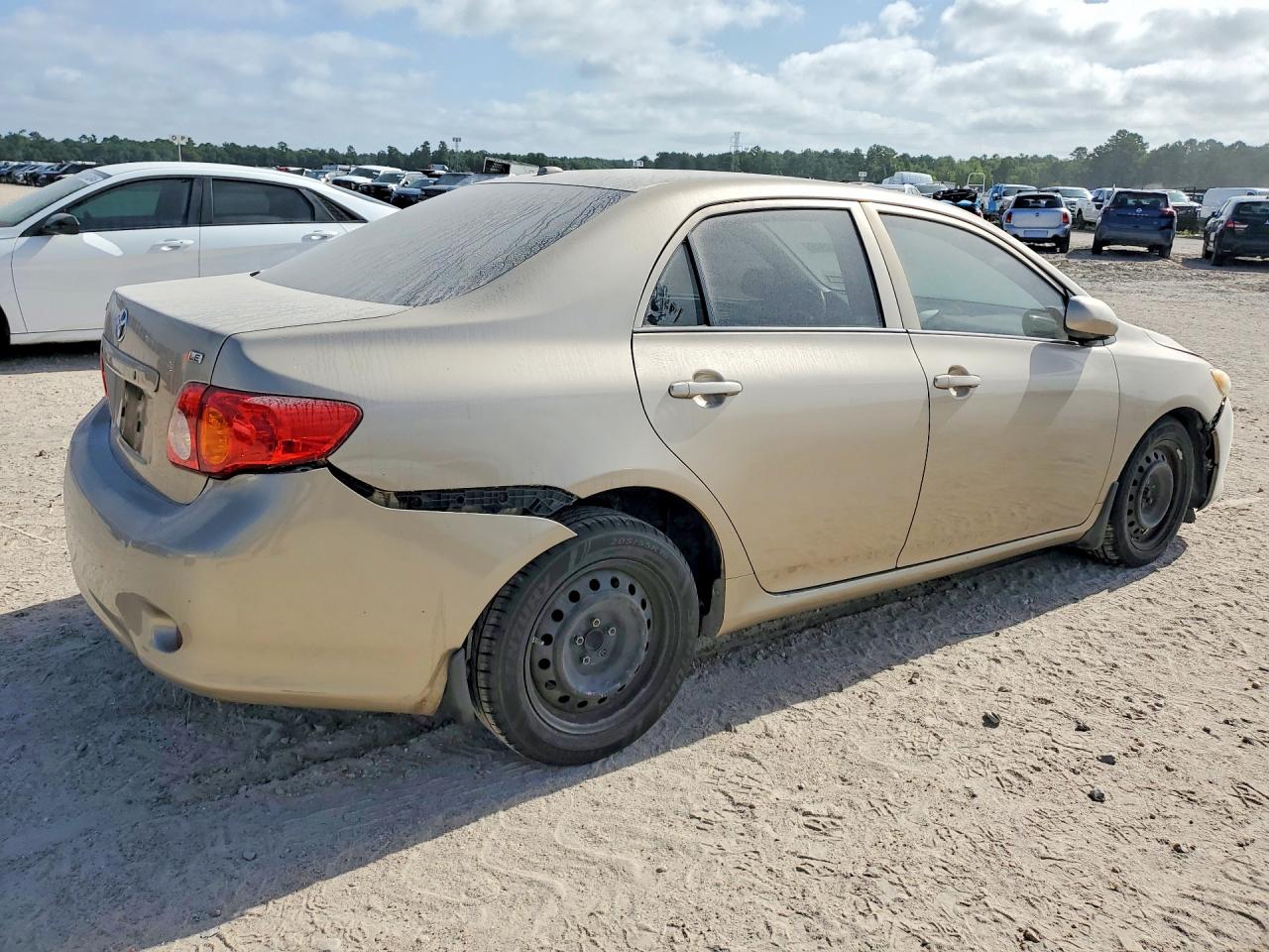 2010 Toyota Corolla Le Gold vin: 1NXBU4EE6AZ284006