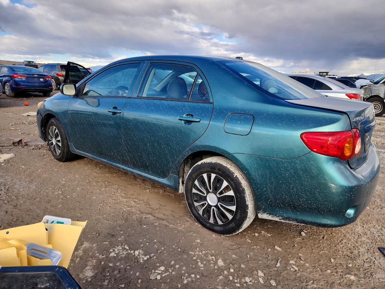 2010 Toyota Corolla Le Teal vin: 1NXBU4EE6AZ306263