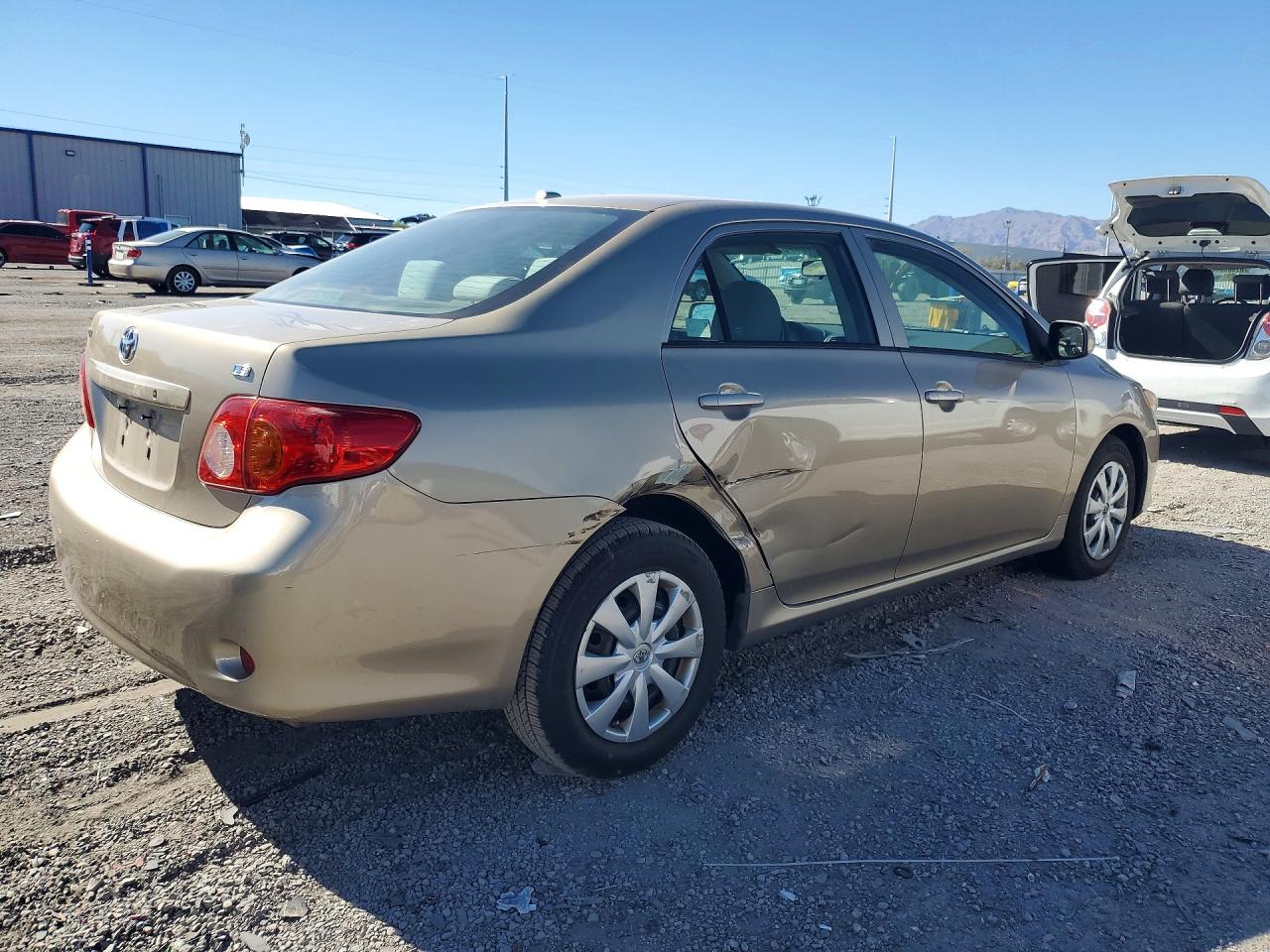 2010 Toyota Corolla Le Gold vin: 1NXBU4EE7AZ237793