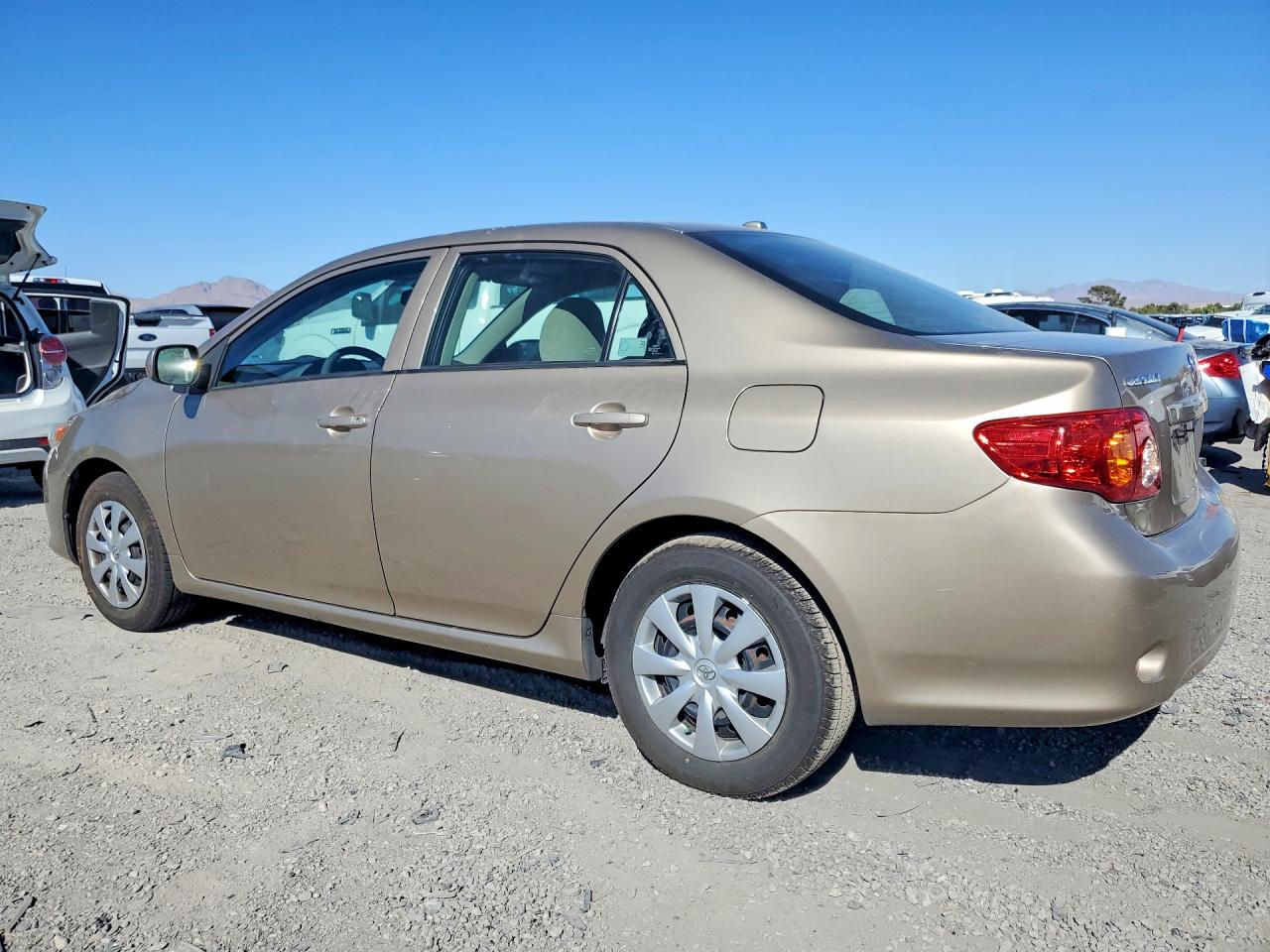 2010 Toyota Corolla Le Gold vin: 1NXBU4EE7AZ237793