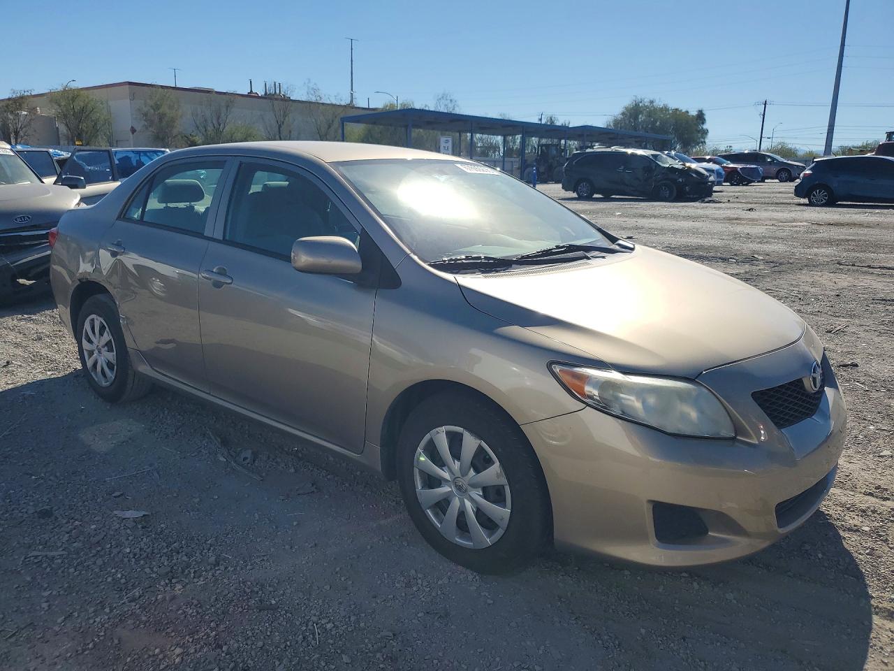2010 Toyota Corolla Le Gold vin: 1NXBU4EE7AZ237793