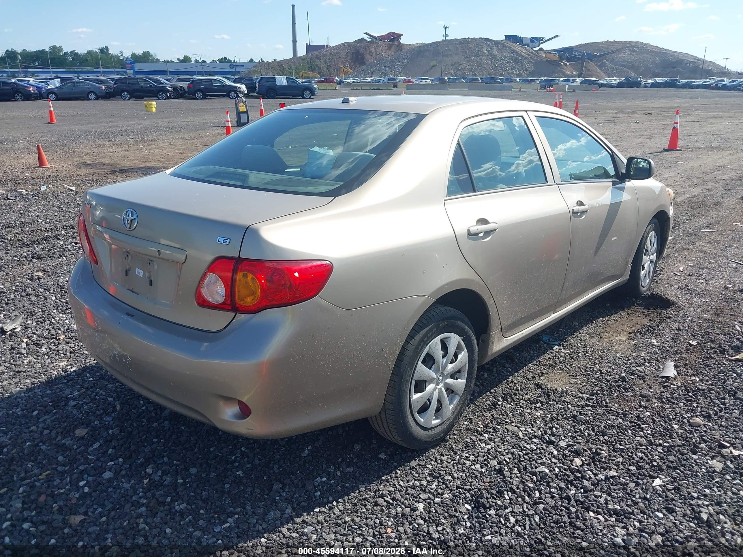 2010 Toyota Corolla Le Gold vin: 1NXBU4EE8AZ228925