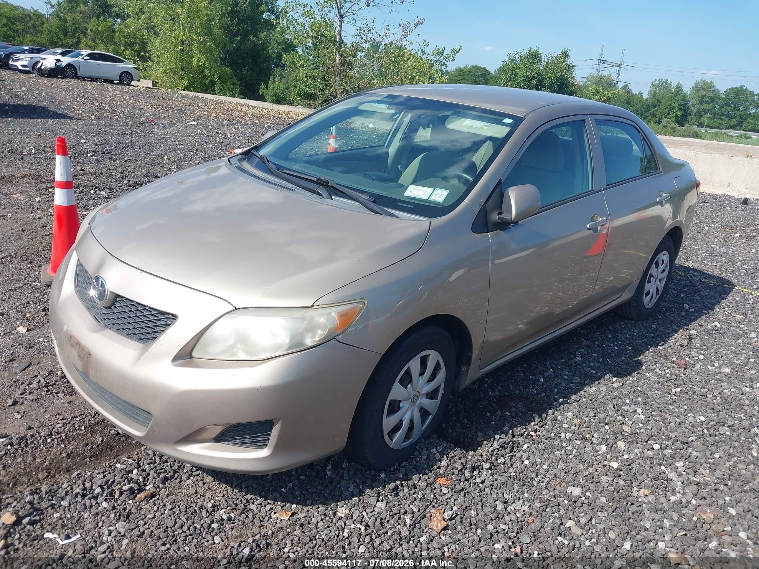 2010 Toyota Corolla Le Gold vin: 1NXBU4EE8AZ228925