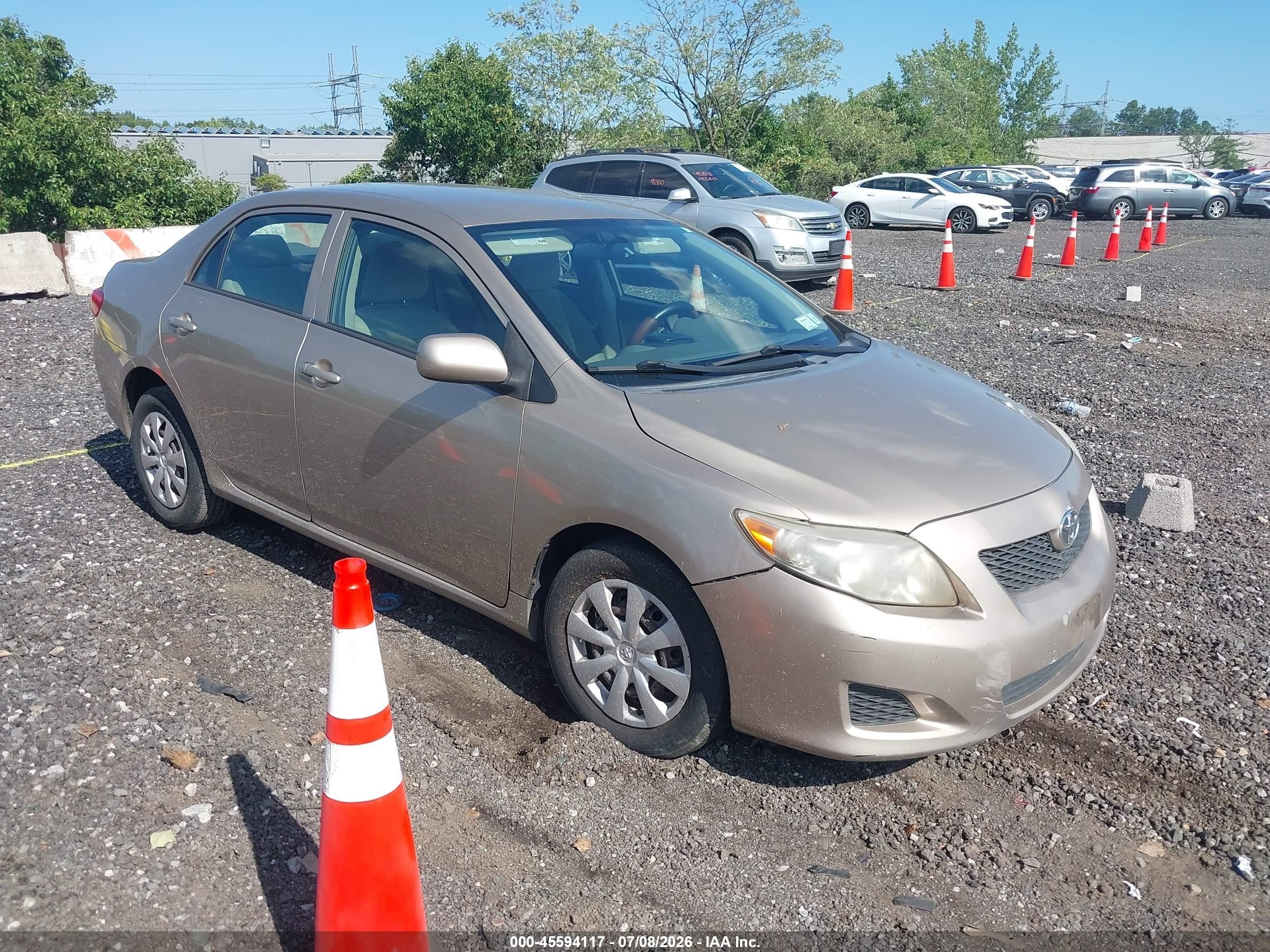 2010 Toyota Corolla Le Gold vin: 1NXBU4EE8AZ228925