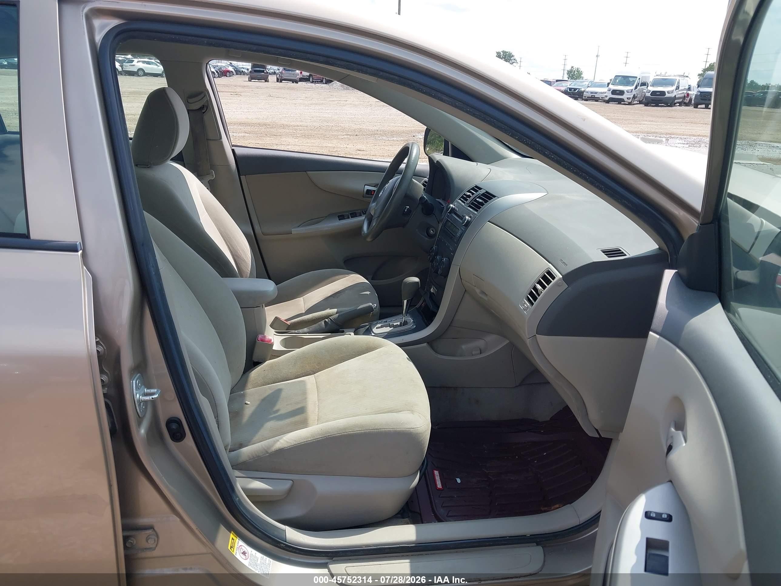 2010 Toyota Corolla Le Tan vin: 1NXBU4EE8AZ316065