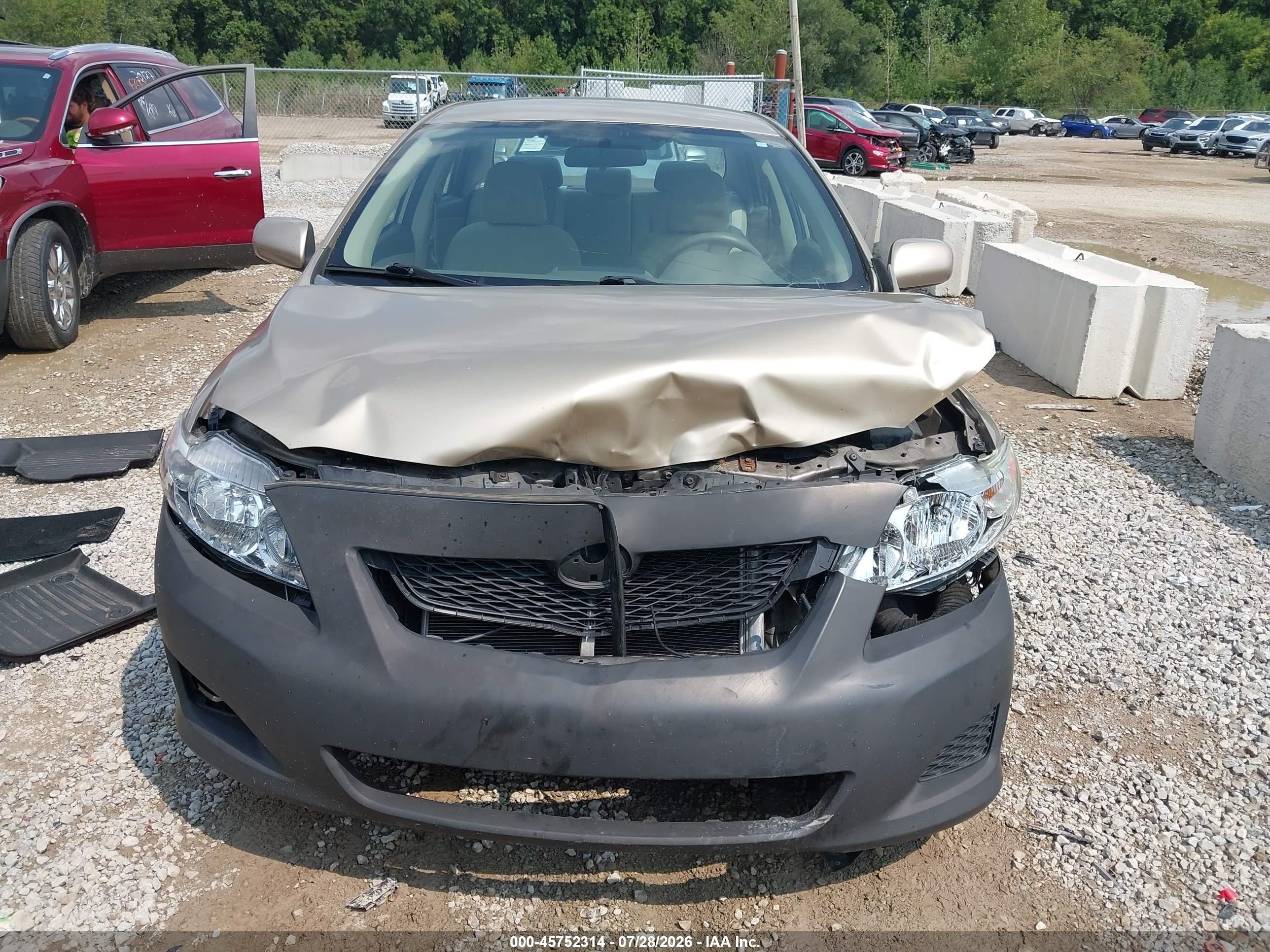 2010 Toyota Corolla Le Tan vin: 1NXBU4EE8AZ316065