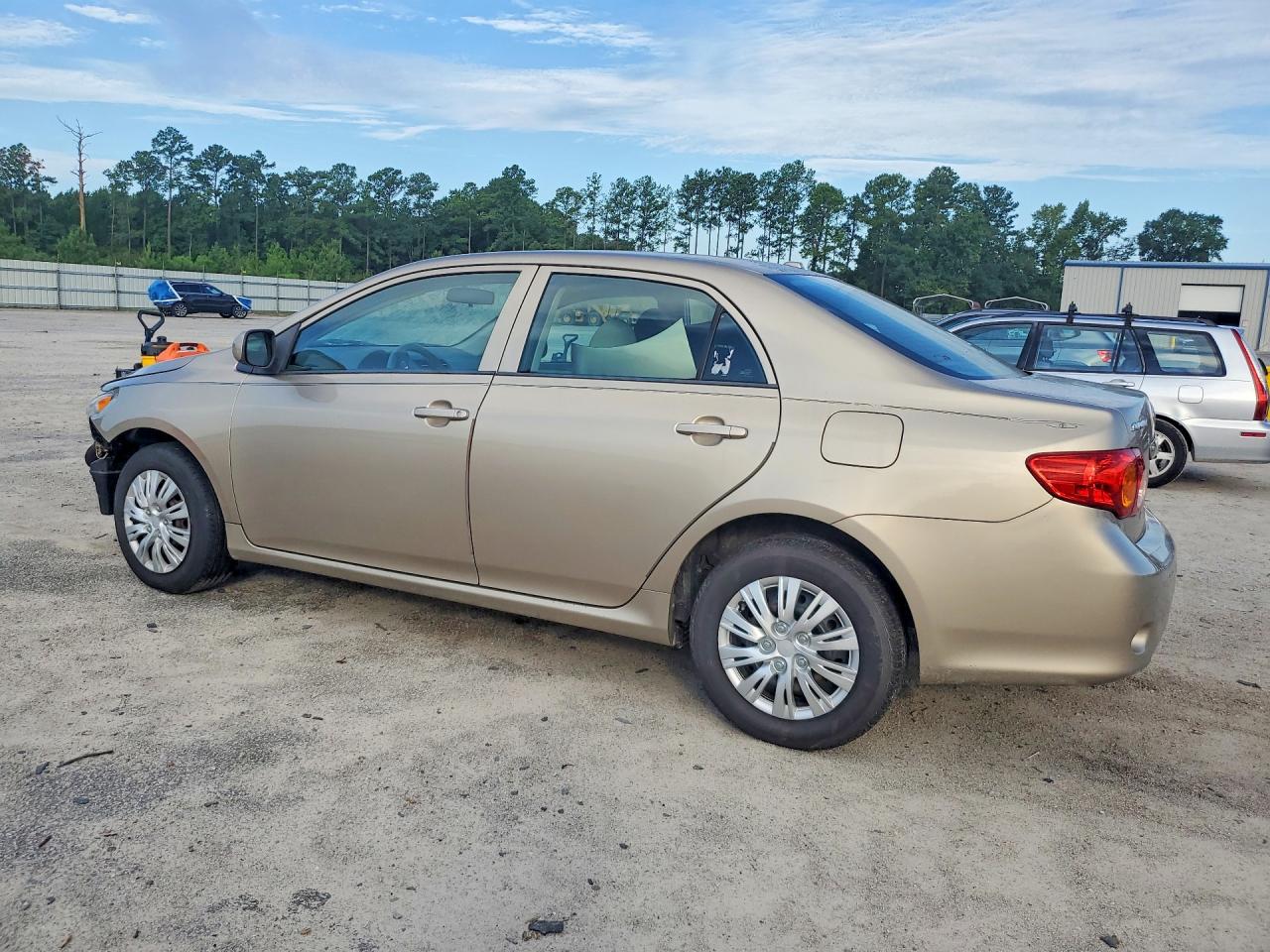 2010 Toyota Corolla Le Gold vin: 1NXBU4EE9AZ191934