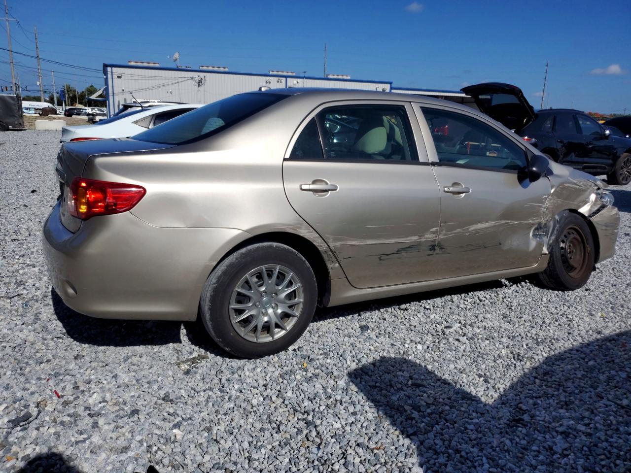 2010 Toyota Corolla Base Tan vin: 1NXBU4EE9AZ233003