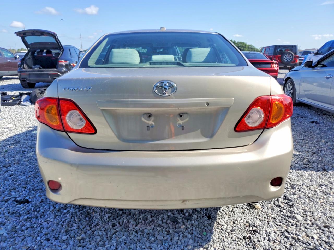 2010 Toyota Corolla Base Tan vin: 1NXBU4EE9AZ233003