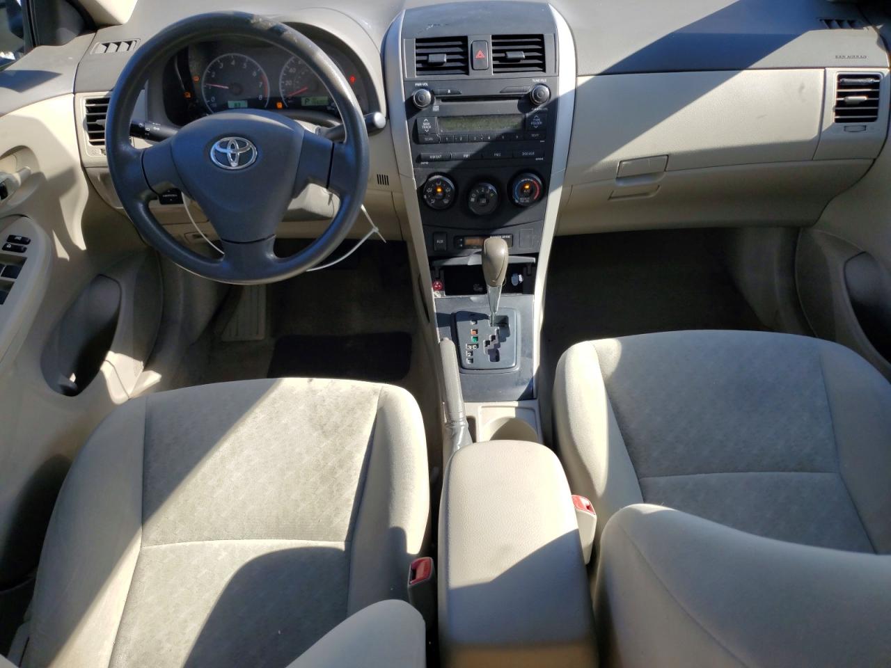 2010 Toyota Corolla Base Tan vin: 1NXBU4EE9AZ233003