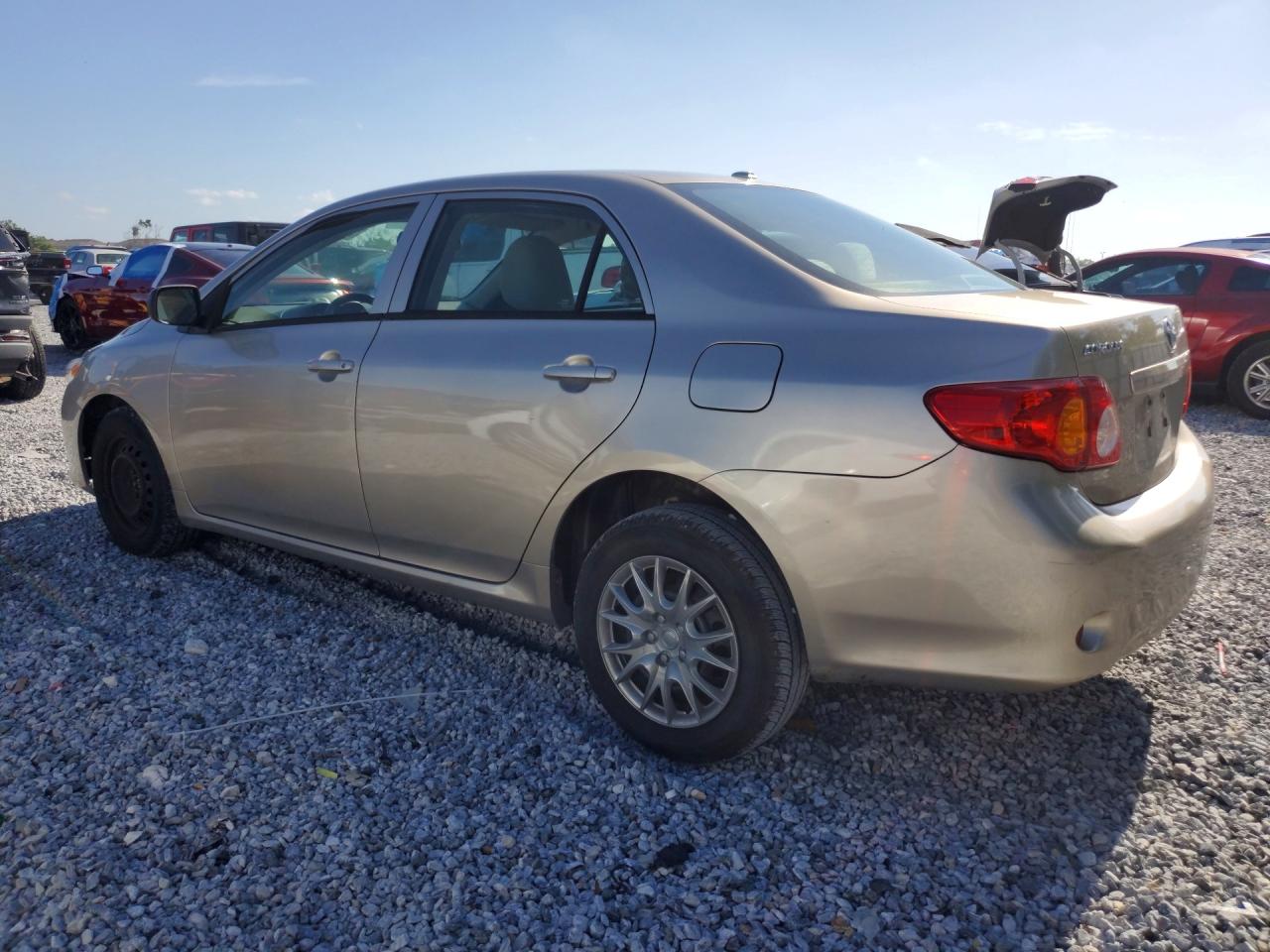 2010 Toyota Corolla Base Tan vin: 1NXBU4EE9AZ233003
