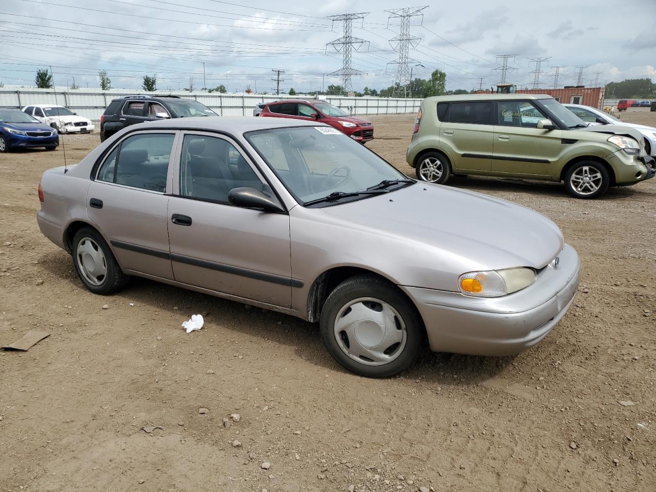 2001 Chevrolet Geo Prizm Base Бежевый vin: 1Y1SK52801Z402452