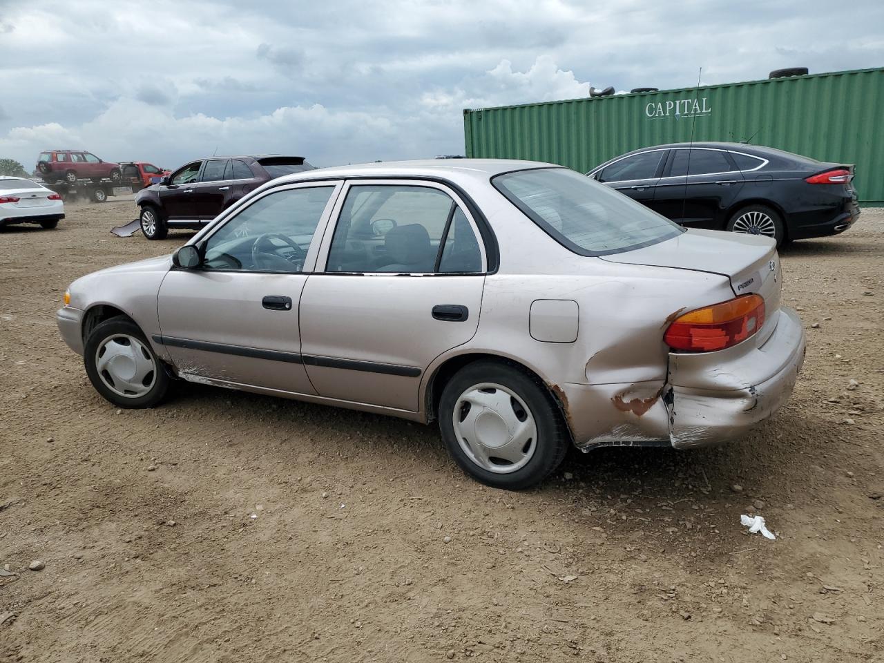 2001 Chevrolet Geo Prizm Base Бежевый vin: 1Y1SK52801Z402452
