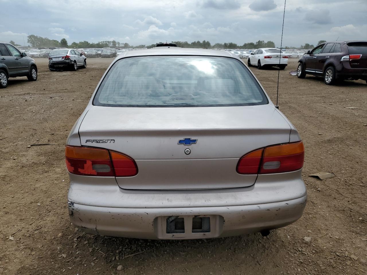 2001 Chevrolet Geo Prizm Base Бежевый vin: 1Y1SK52801Z402452