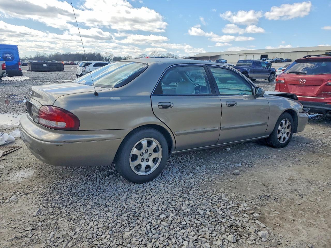 1998 Mazda 626 Dx Tan vin: 1YVGF22C8W5773403
