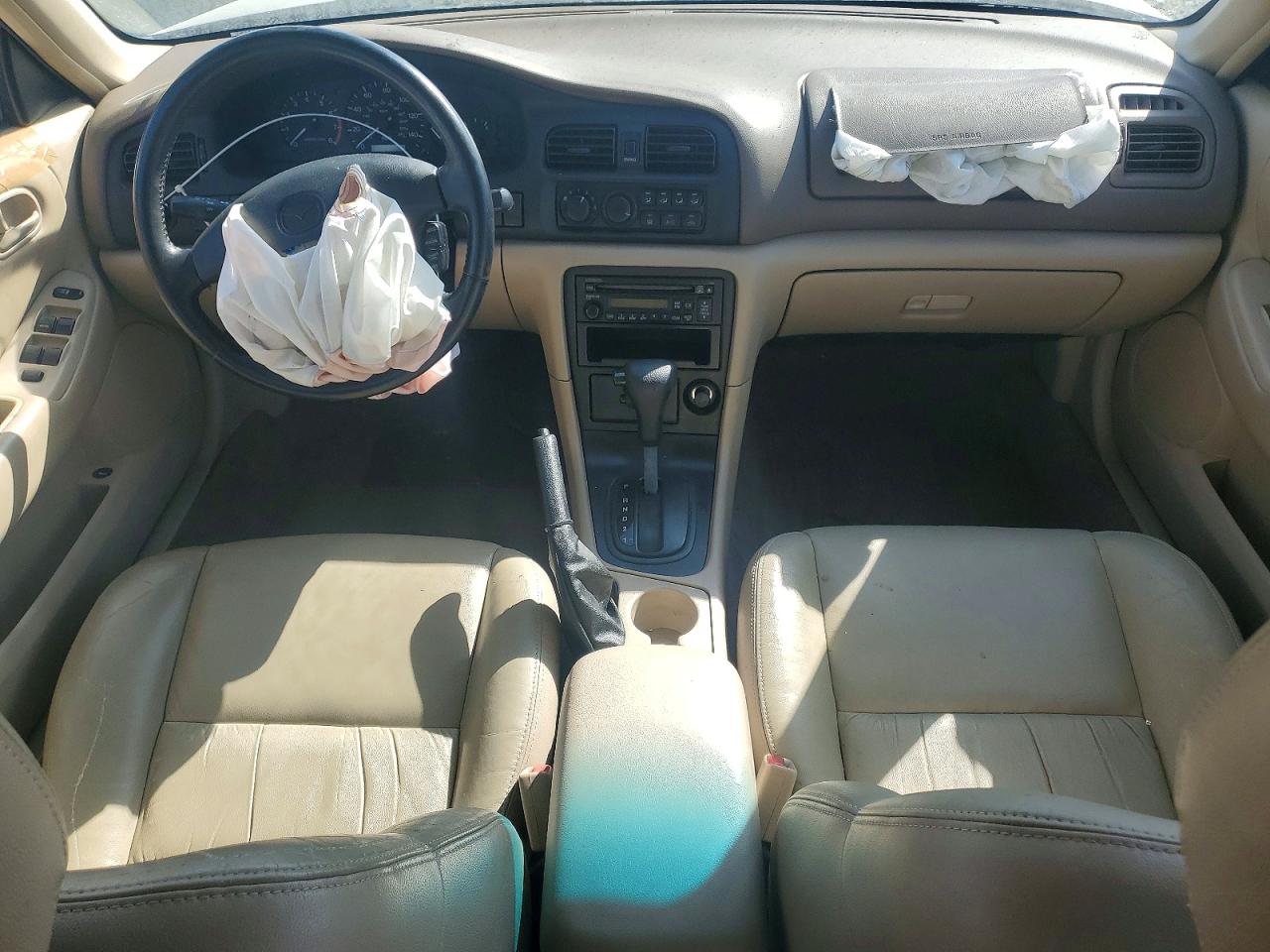 1998 Mazda 626 Dx Tan vin: 1YVGF22C8W5773403