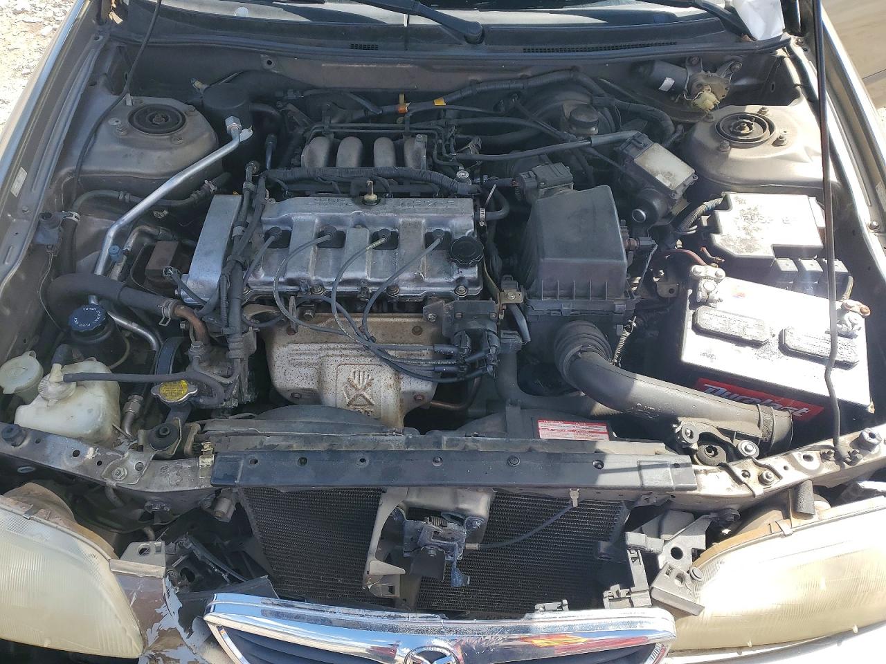 1998 Mazda 626 Dx Tan vin: 1YVGF22C8W5773403