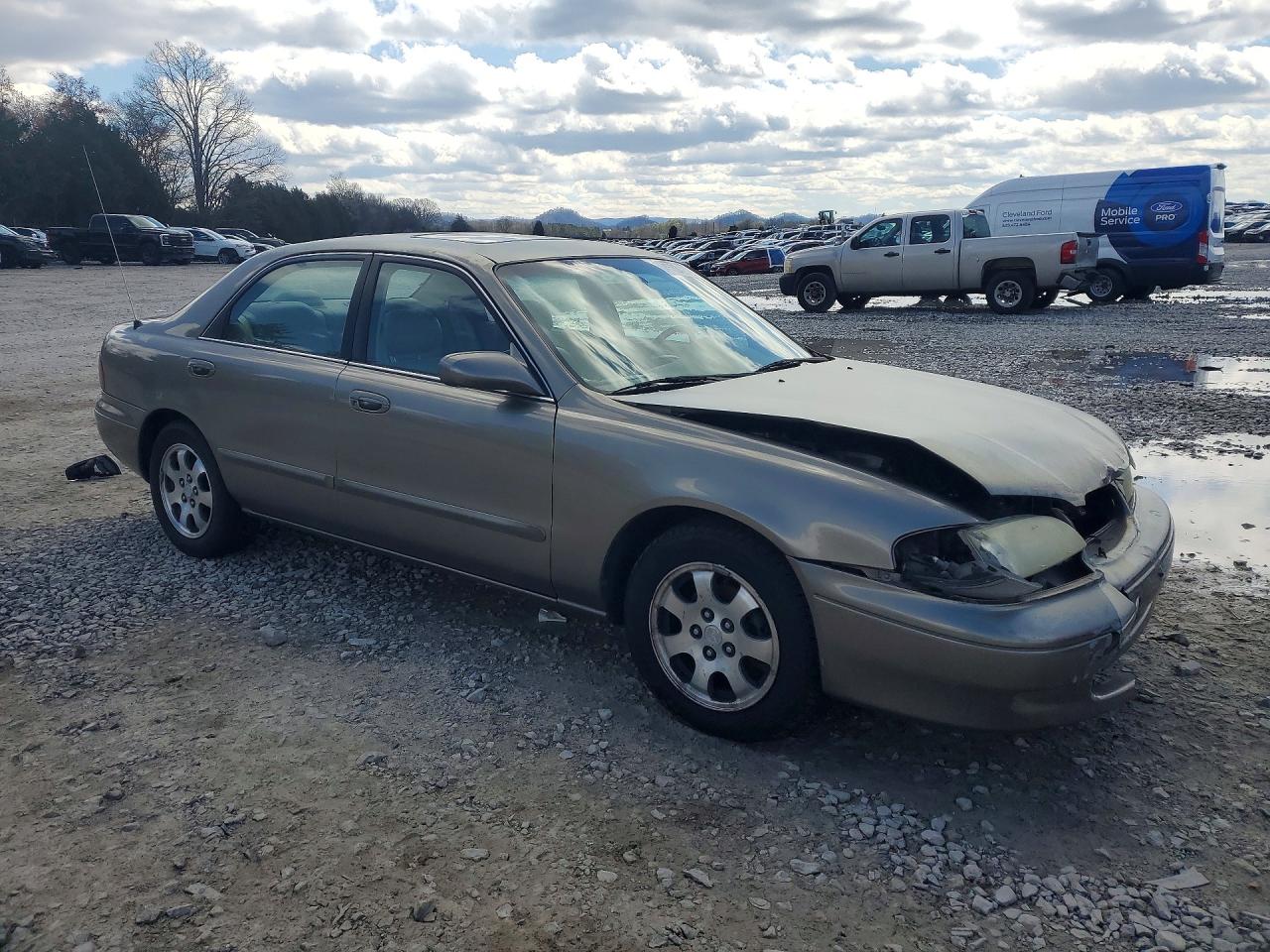 1998 Mazda 626 Dx Tan vin: 1YVGF22C8W5773403