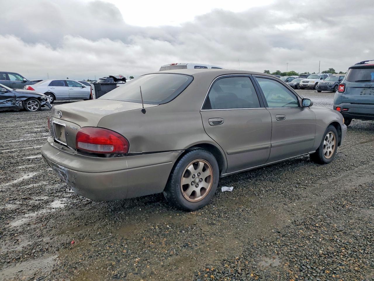 1999 Mazda 626 Es Tan vin: 1YVGF22C9X5880008