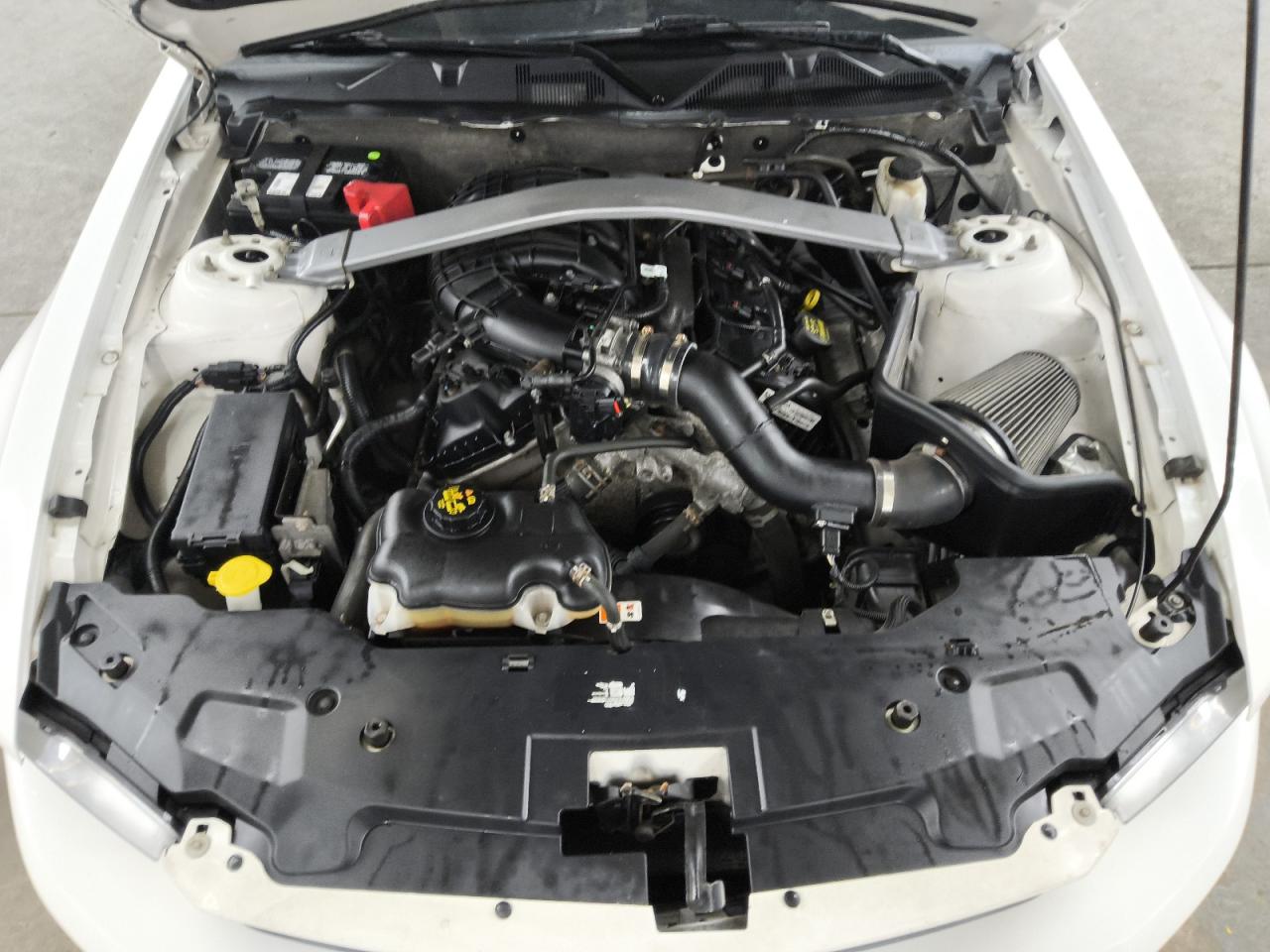 2012 Ford Mustang White vin: 1ZVBP8EM4C5218543 Damage: Air Intake Duct, Aftermarket, Acceptable