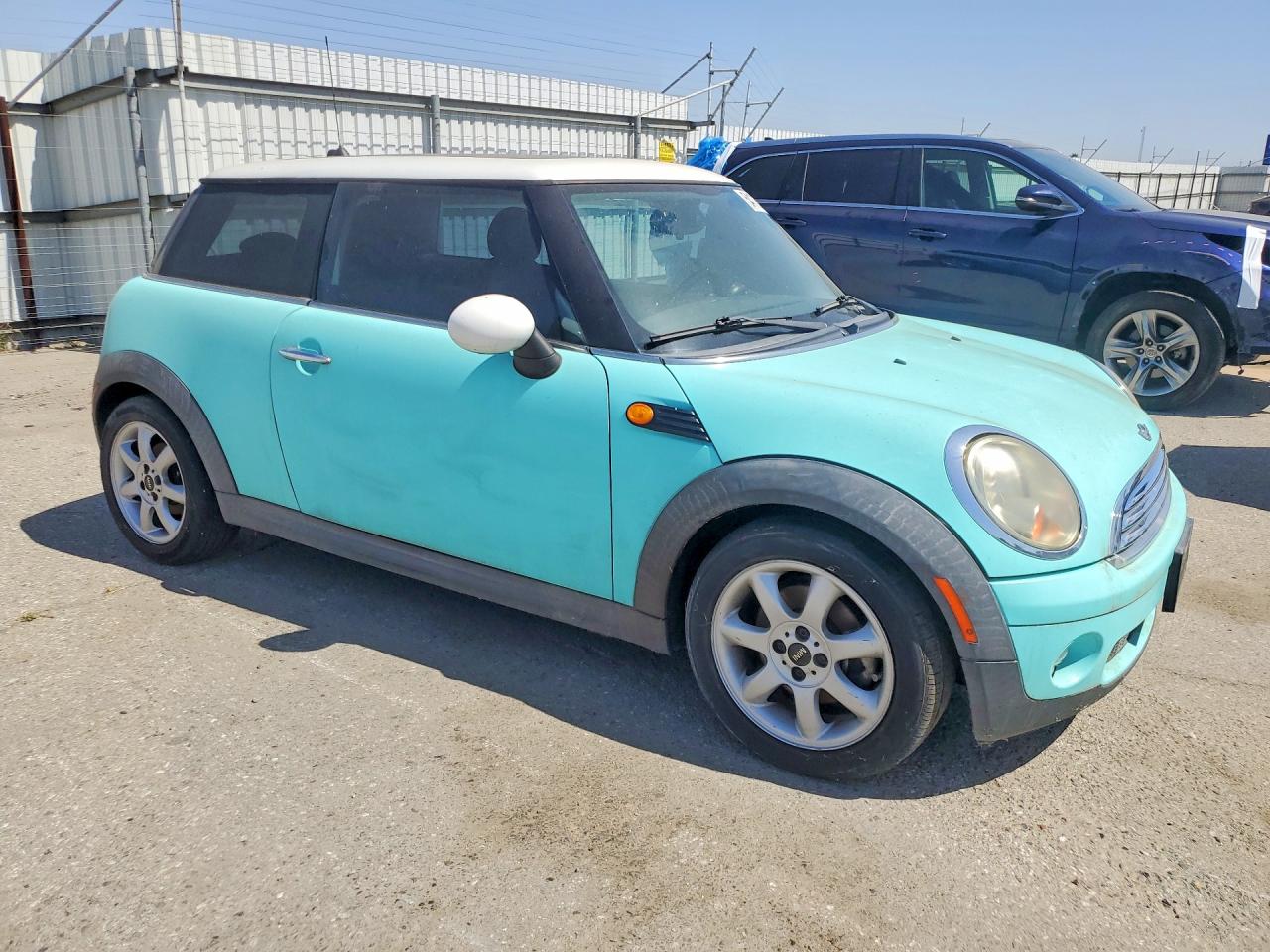 2009 Mini Cooper Turquoise vin: WMWMF33519TW79262