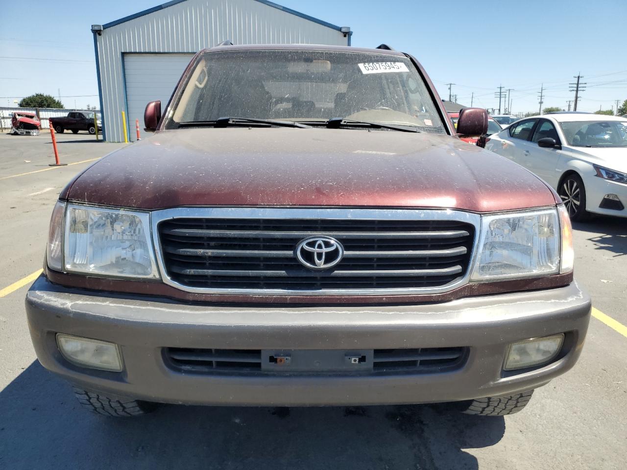 1999 Toyota Land Cruiser    Burgundy vin: JT3HT05JXX0048695