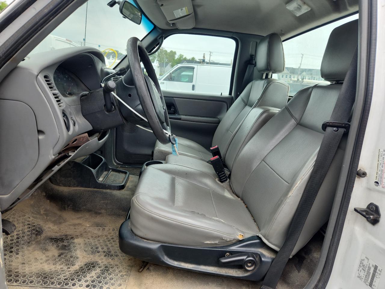2010 Ford Ranger White vin: 1FTKR1AD8APA09799 Damage: Left Front Seat Cushion, Torn, 4 To 5 Inches
