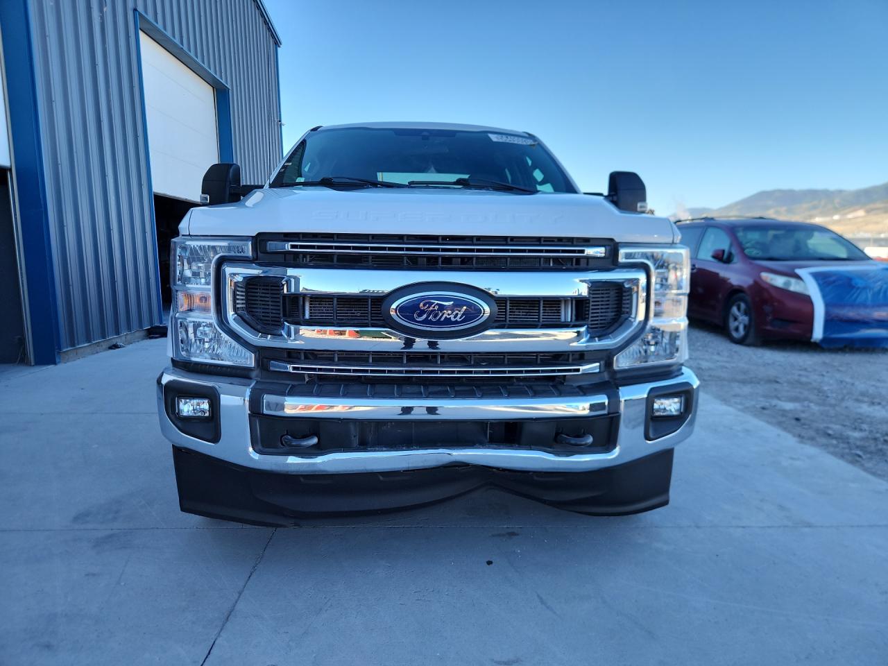2021 Ford F250 Super Duty White vin: 1FT7W2BT1MED72780 Damage: Front Valance, Dent(S) W/No Paint Dmg, 6 To 7 Inches