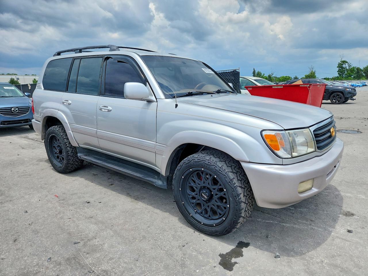 1999 Toyota Land Cruiser Base Gold vin: JT3HT05J5X0027141