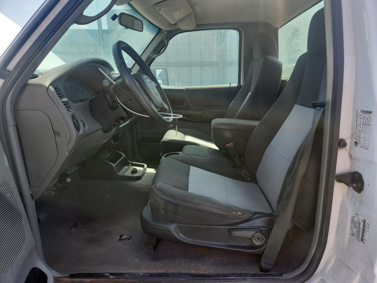 2007 Ford Ranger White vin: 1FTYR10D27PA83157 Damage: Left Front Seat Cushion, Torn, 2 To 3 Inches