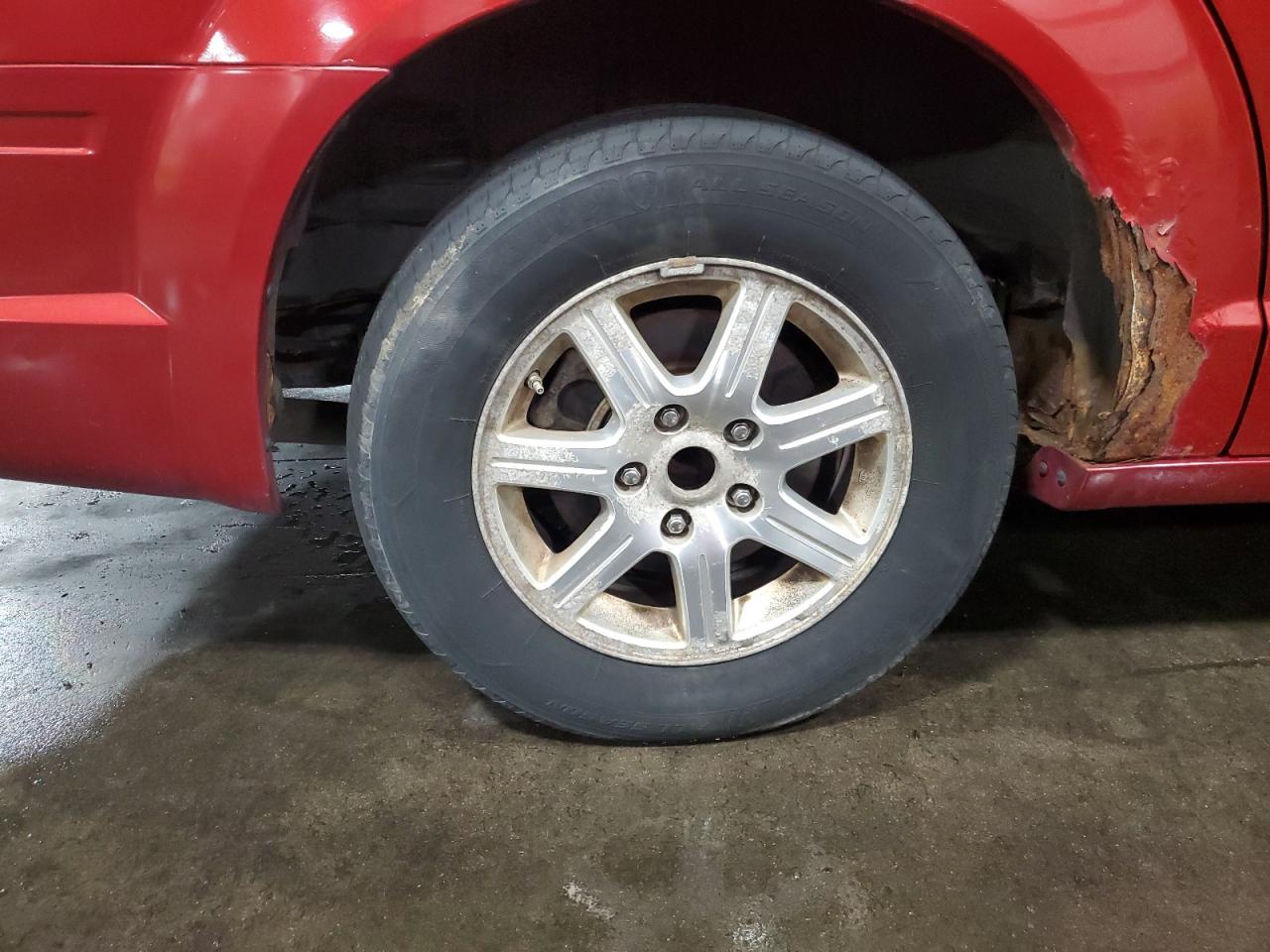 2009 Chrysler Town & Country Touring Red vin: 2A8HR541X9R547779 Damage: Right Rear Wheel, Pitted, Replacement Required