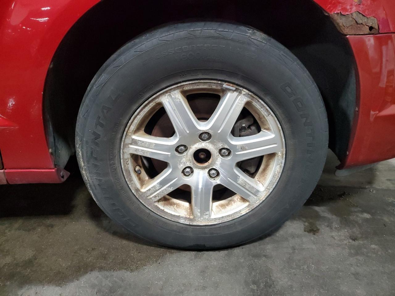 2009 Chrysler Town & Country Touring Red vin: 2A8HR541X9R547779 Damage: Right Front Wheel, Pitted, Replacement Required