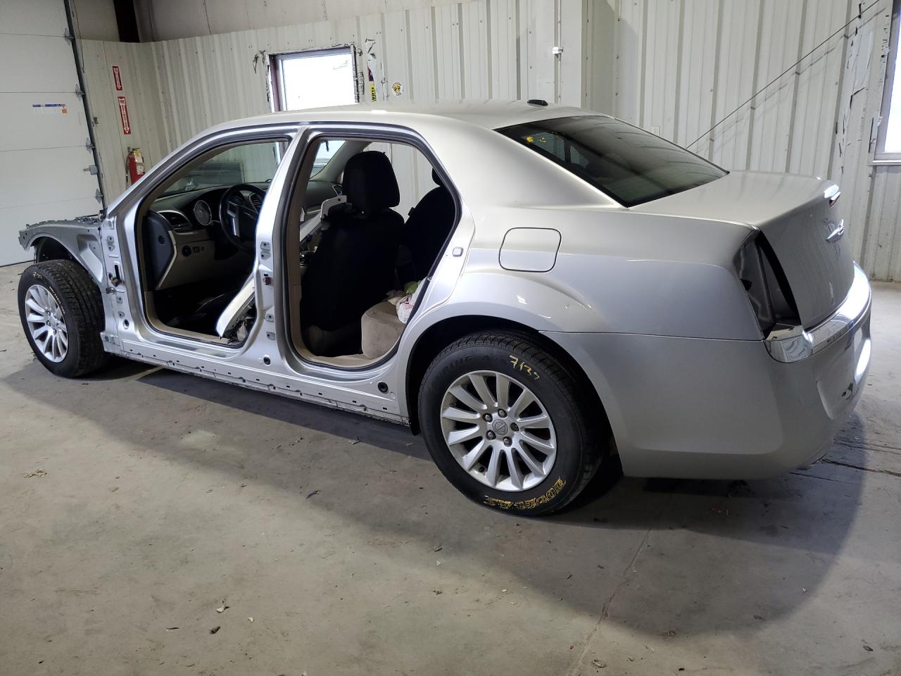 2012 Chrysler 300 Silver vin: 2C3CCAAG1CH289268 Damage: Left Qtr Panel, Dent(S) W/ Paint Dmg, 1/2 To 1 Inch