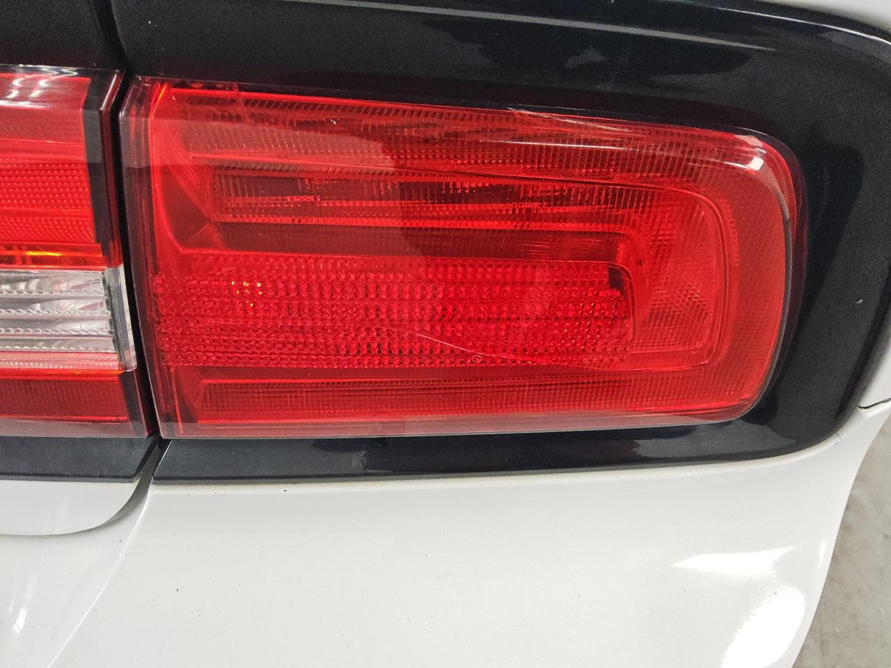 2014 Dodge Charger Police White vin: 2C3CDXAT5EH206781 Damage: Right Tail Light, Cracked, Replacement Required