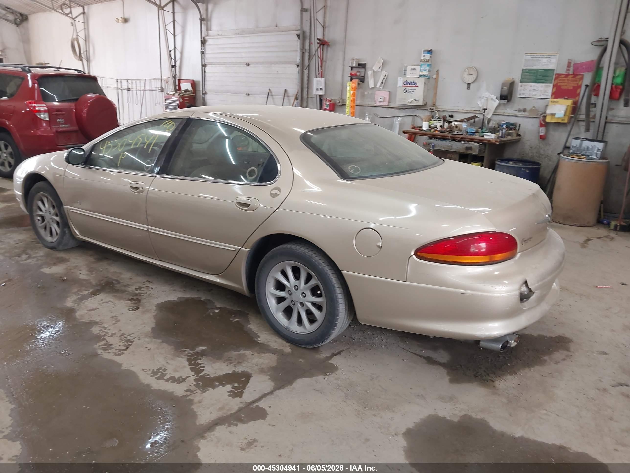 2000 Chrysler Lhs   Gold vin: 2C3HC56GXYH423935
