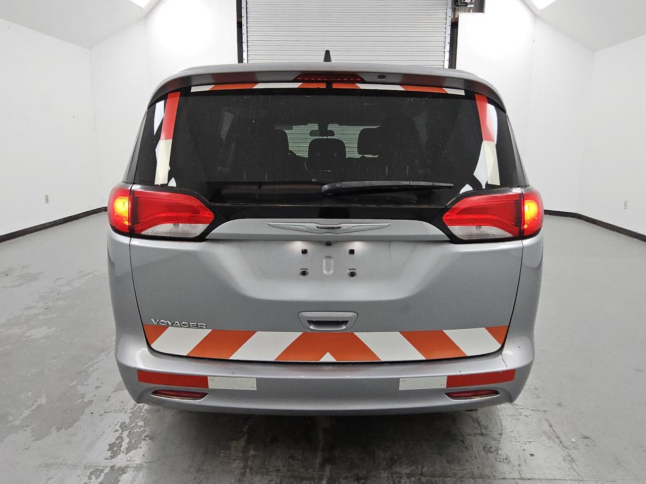 2021 Chrysler Voyager Lx Silver vin: 2C4RC1CG3MR580269 Damage: Rear Bumper, Heavy Scratch, 2 To 3 Inches