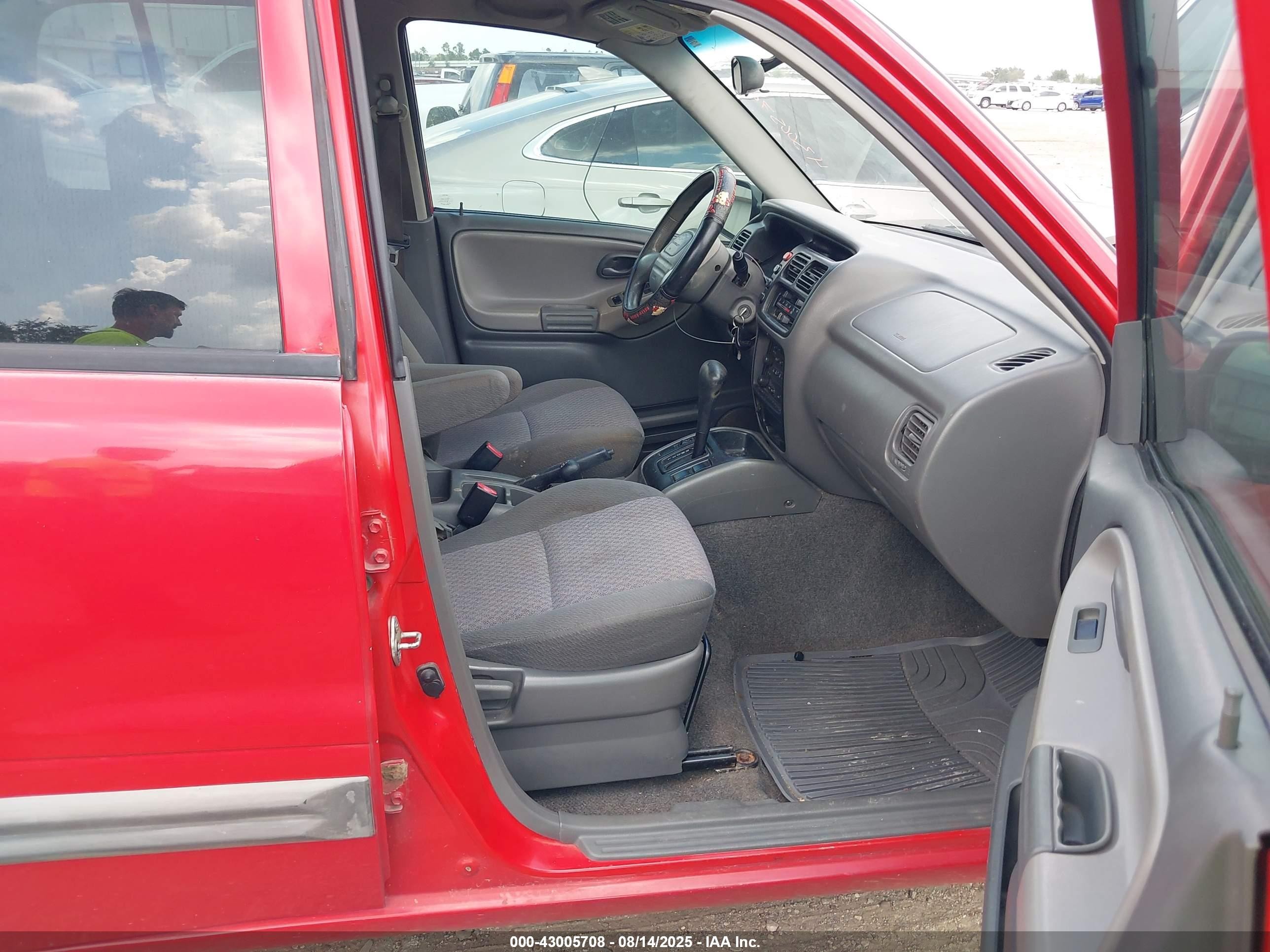 2004 Chevrolet Tracker   Red vin: 2CNBJ134546916076